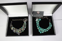 Two boxed contemporary silver and gemstone statement collar necklaces. One set with oval turquoise