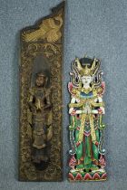 Two carved Buddhist wall panels hand painted and decorated in gilt. H.143 W.35 cm. (largest)