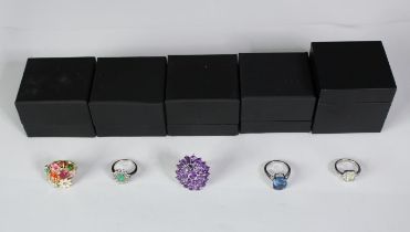 Five boxed silver and gemstone dress rings, set with emerald, amethyst, blue topaz and ruby. Various