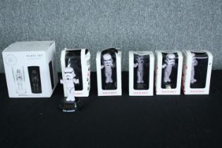 A collection of solar powered Star Wars Stormtrooper figures and a set of glasses. H.17 W.14 D.14cm.