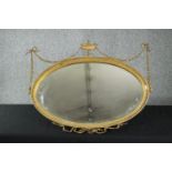 Wall mirror. early 20th century gilt Adam style with urn and husk gesso decoration. H.71 W.87cm.