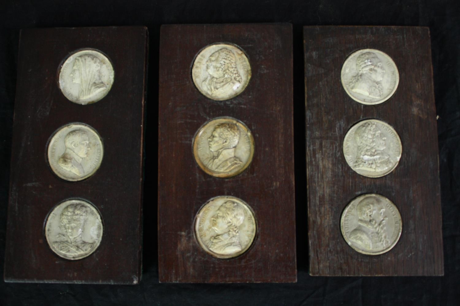 A collection of nineteenth century plaster medal dies mounted on wood. Including the Dupin A.M.J.