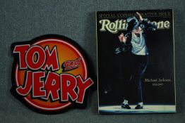 Two modern decorative metal signs. Tom and Jerry and a Michael Jackson Rolling Stone magazine cover.