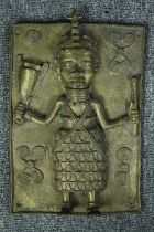 Benin African plaque. Probably a king in regalia bearing symbols of royal power. H.33 D.22cm.
