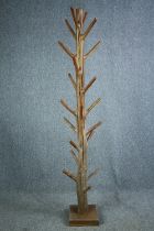 An Eastern hardwood full height coatstand. H.205cm.