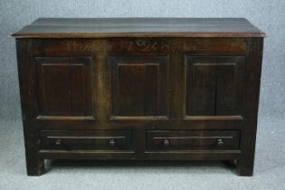 Mule Chest, 18th century oak, carved, dated 1725 and inscribed. H.88 W.140 D.57cm.