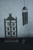 Chinese chimes. Eight bells and a bird housed in a wooden mount. Also, a hanging wind chime. H.58cm.