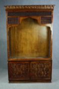 Bookcase cabinet, carved hardwood of North African influence, in two sections. H.200 W.123 D.34cm.