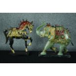 Two candle holders. A metal elephant and horse. Hand painted and decorated with ceremonial riding