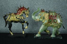 Two candle holders. A metal elephant and horse. Hand painted and decorated with ceremonial riding