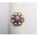 A Victorian Star ruby and cultured pearl and yellow metal (tests higher than 9ct) cluster ring.