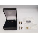 A collection of yellow metal gem set stud earrings and a bag containing three pairs of 9ct yellow