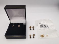 A collection of yellow metal gem set stud earrings and a bag containing three pairs of 9ct yellow