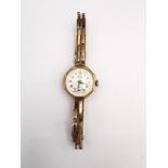 A Vintage ladies automatic Limit 9ct gold cocktail watch with sprung bracelet and octagonal face,