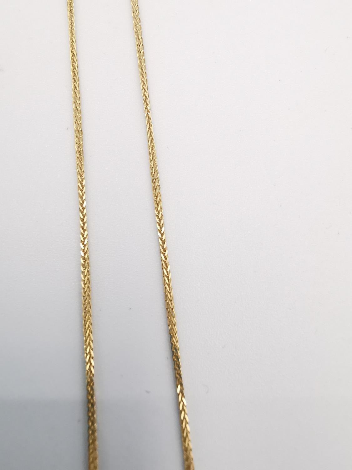 A boxed 18 carat yellow gold pendant by Zolotas and 14ct chain. The pendant in the form of a - Image 4 of 5