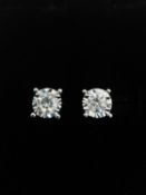 A pair of 18ct white gold and diamond stud earrings, each earrings set with a round brilliant cut