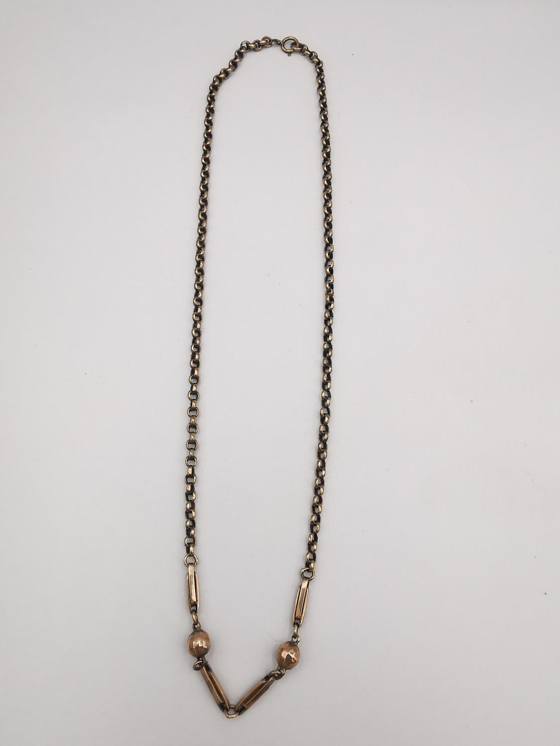 A Victorian 9ct rose gold chain with ball and bar design to the front, the rest of the chain rolo
