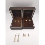 Four pairs of 9ct gold stud and drop earrings and one single ball earring, two boxed. Two pairs of