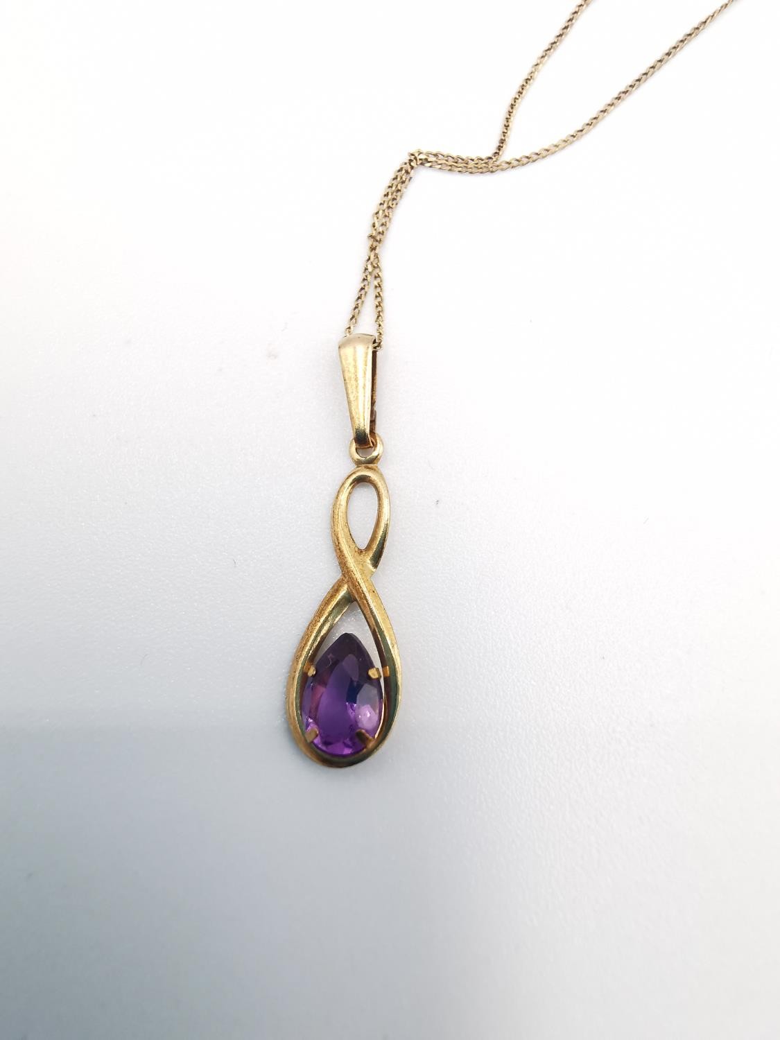 A 9ct rose gold and amethyst pendant with chain and earrings set. The infinity design pendant set - Image 6 of 8