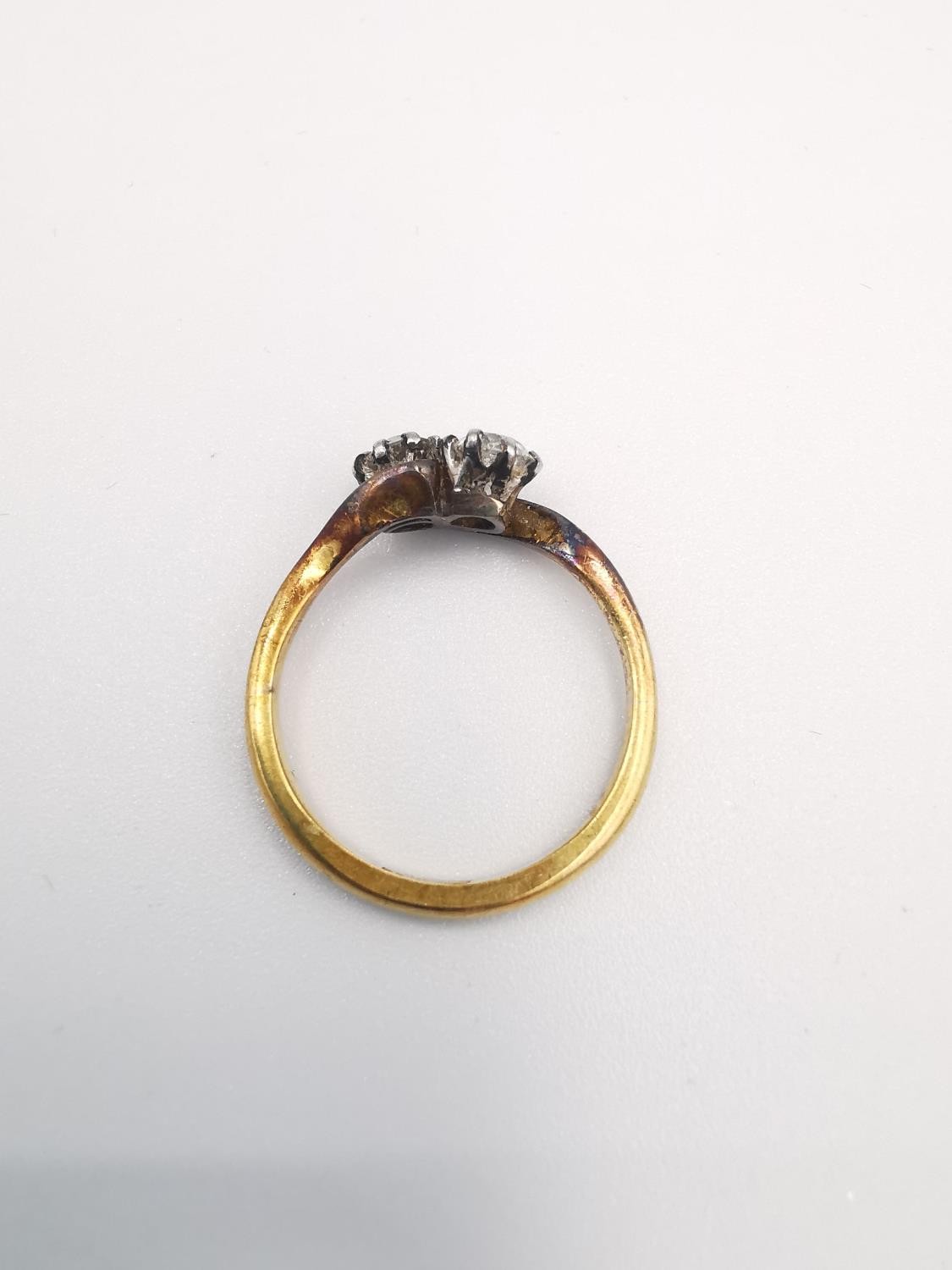 An 18ct yellow gold old mine diamond cross over ring. Set with two cushion shaped old mine - Image 3 of 4