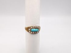 A yellow metal Georgian turquoise and seed pearl mourning ring, engraved foliate shoulders flowing