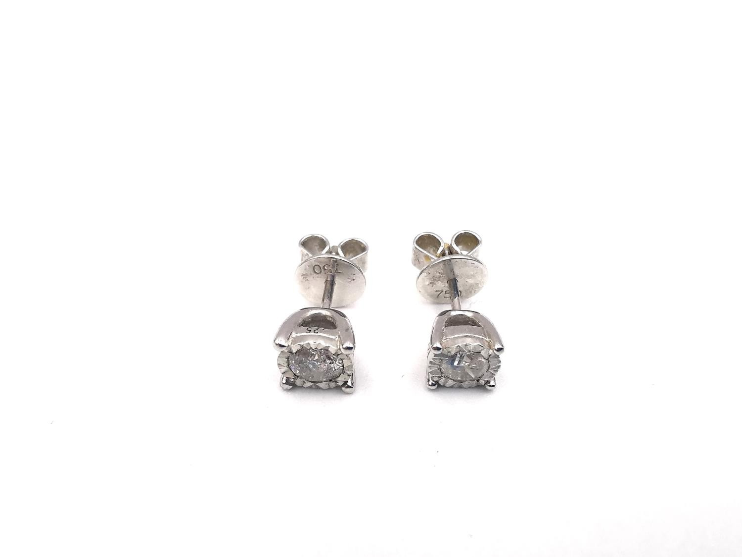 A pair of 18ct white gold and diamond stud earrings, each earrings set with a round brilliant cut - Image 2 of 6
