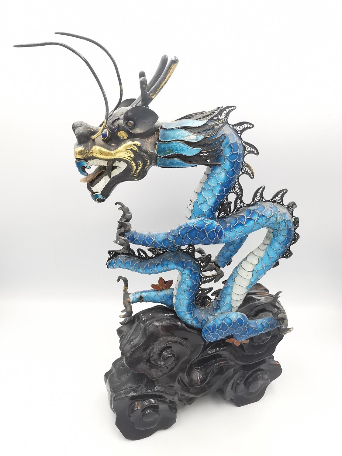 An early 20th century Chinese white metal and cloisonne enamel wirework dragon on a carved cloud - Image 5 of 9