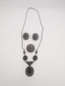 A collection of silver and Bohemian garnet jewellery, a articulated cluster necklace, pair of clip