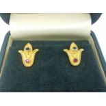 A boxed set of 18ct yellow gold ruby and sapphire stud earrings by Greek fine jewellers