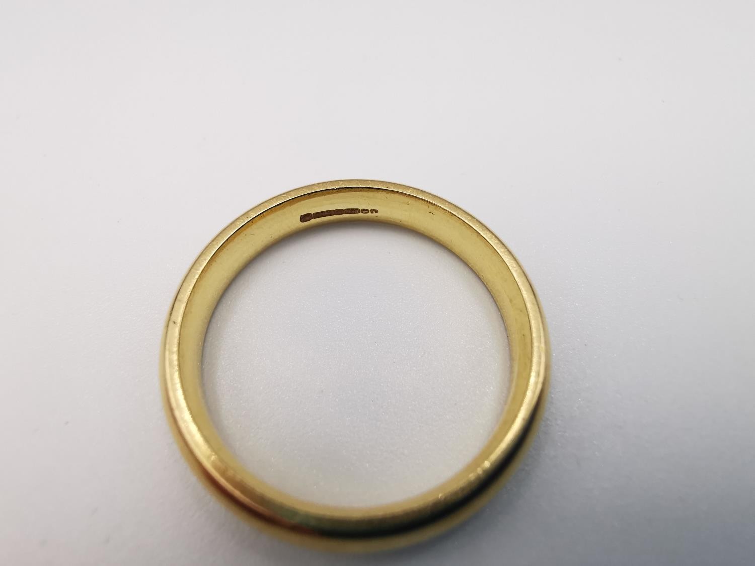 An 18ct yellow gold court shape band. Hallmarked: CPM, Birmingham, 750, 2005. Ring size V. Weight - Image 3 of 3