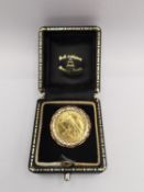 A boxed 1/10 ounce 1987 fine gold Britannia 10 pounds coin mounted in a 9ct gold ring mount with