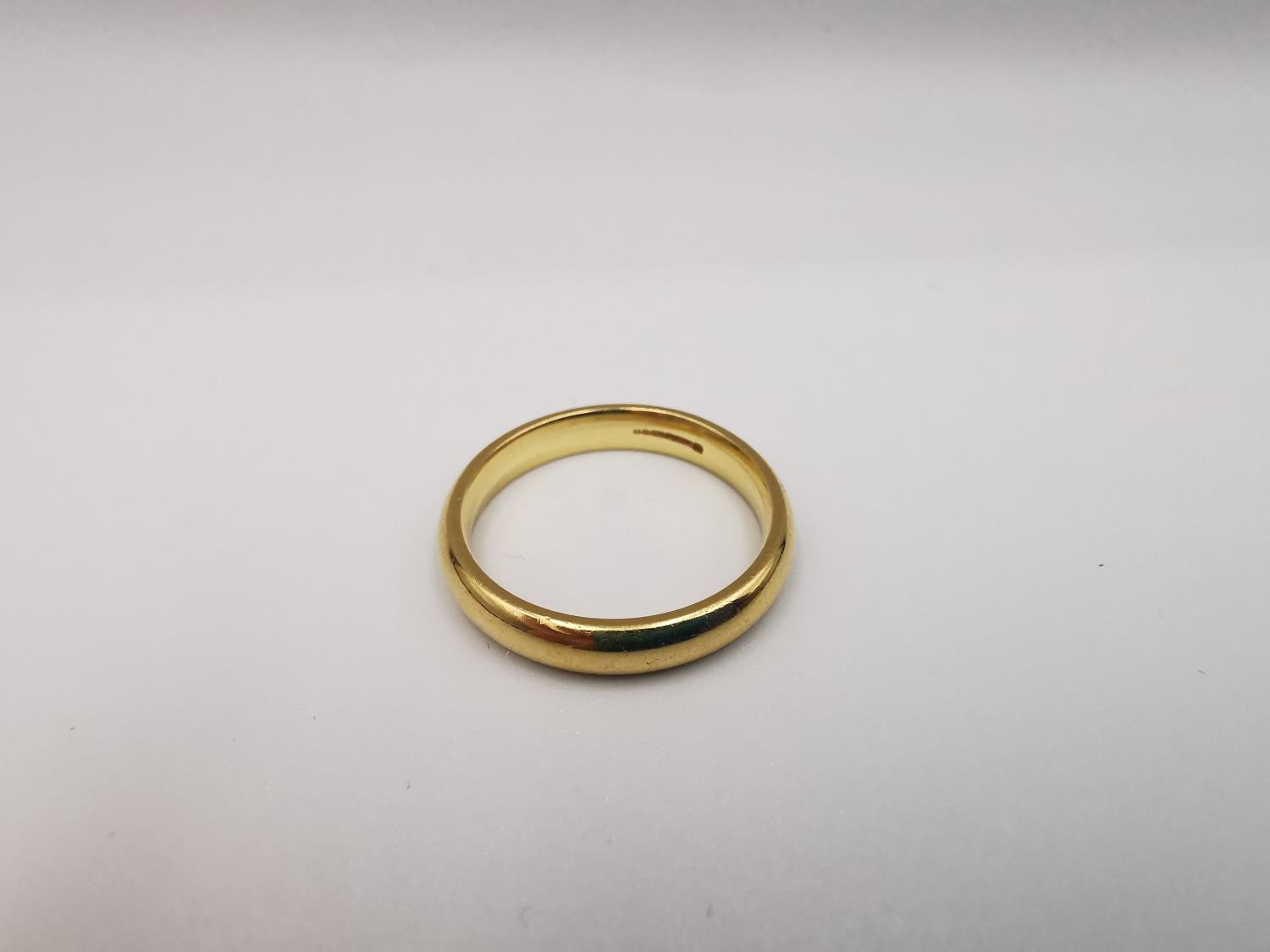 An 18ct yellow gold court shape band. Hallmarked: CPM, Birmingham, 750, 2005. Ring size V. Weight - Image 2 of 3