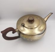 An Art Deco silver teapot with Bakelite handle and finial. Hallmarked: H&H for Hukin & Heath Ltd,