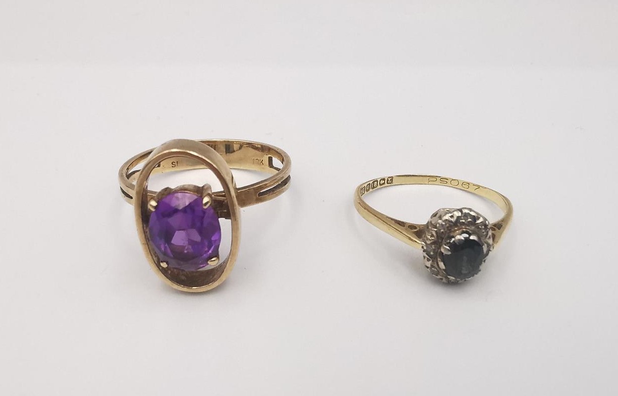 A 10ct yellow gold amethyst dress ring along with an 18ct sapphire and diamond cluster ring. The