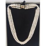 A vintage boxed knotted triple strand cultured pearl necklace with 9ct yellow gold, pearl and ruby