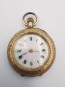 An Edwardian 14ct rose gold Swiss ladies fob watch with engraved design. The back case decorated
