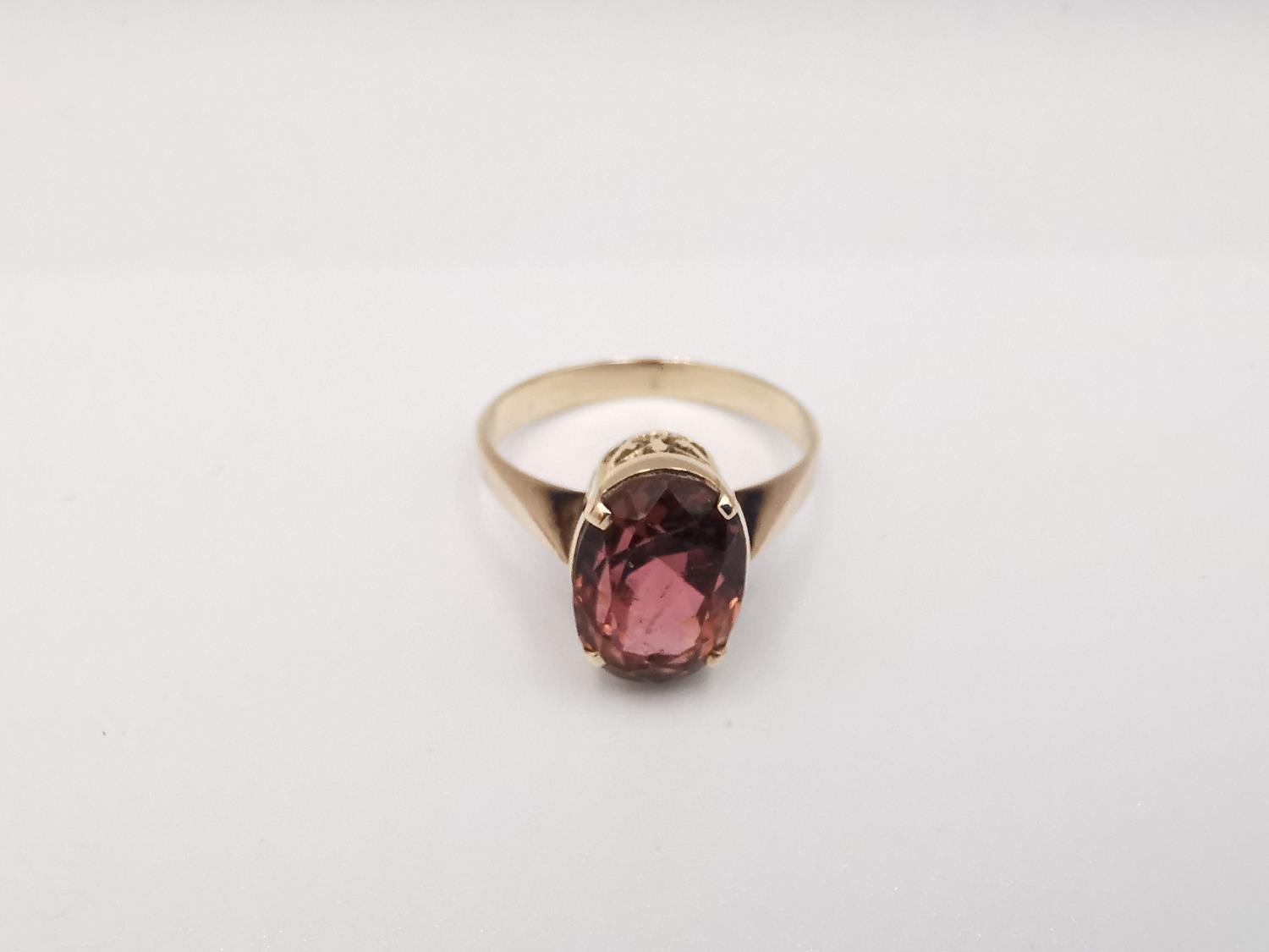 A yellow metal (tests as 9ct or higher) tourmaline dress ring. Set with an oval mixed cut pink - Image 2 of 5