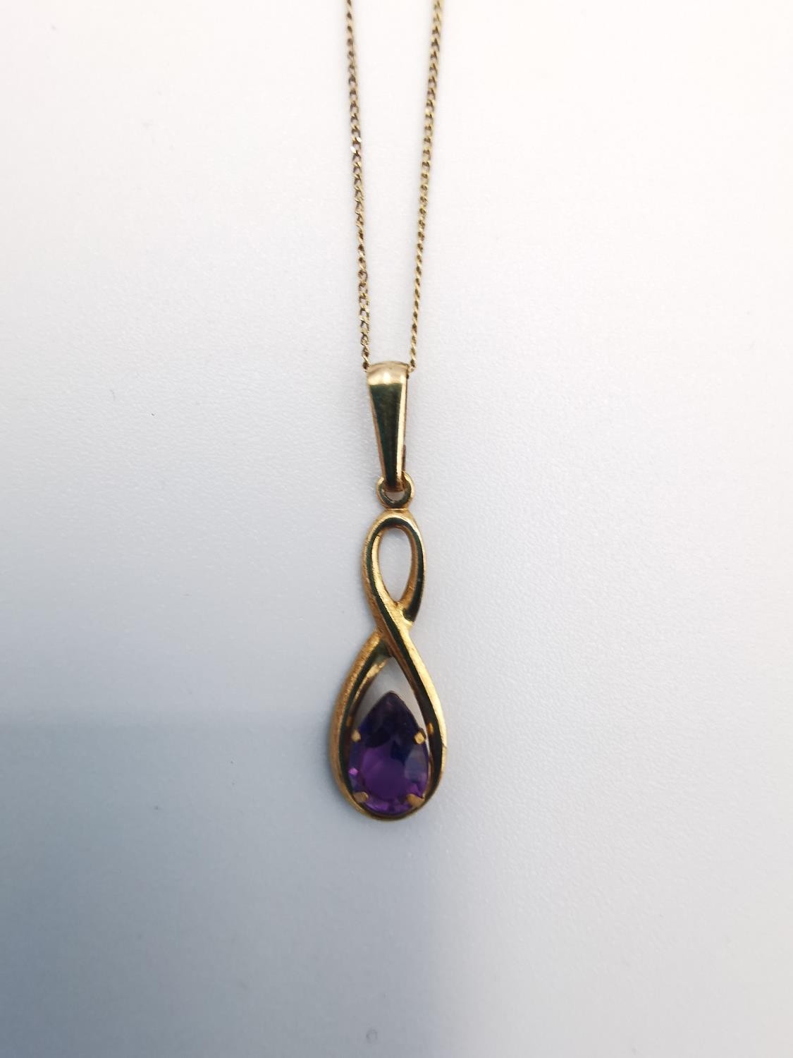 A 9ct rose gold and amethyst pendant with chain and earrings set. The infinity design pendant set - Image 3 of 8