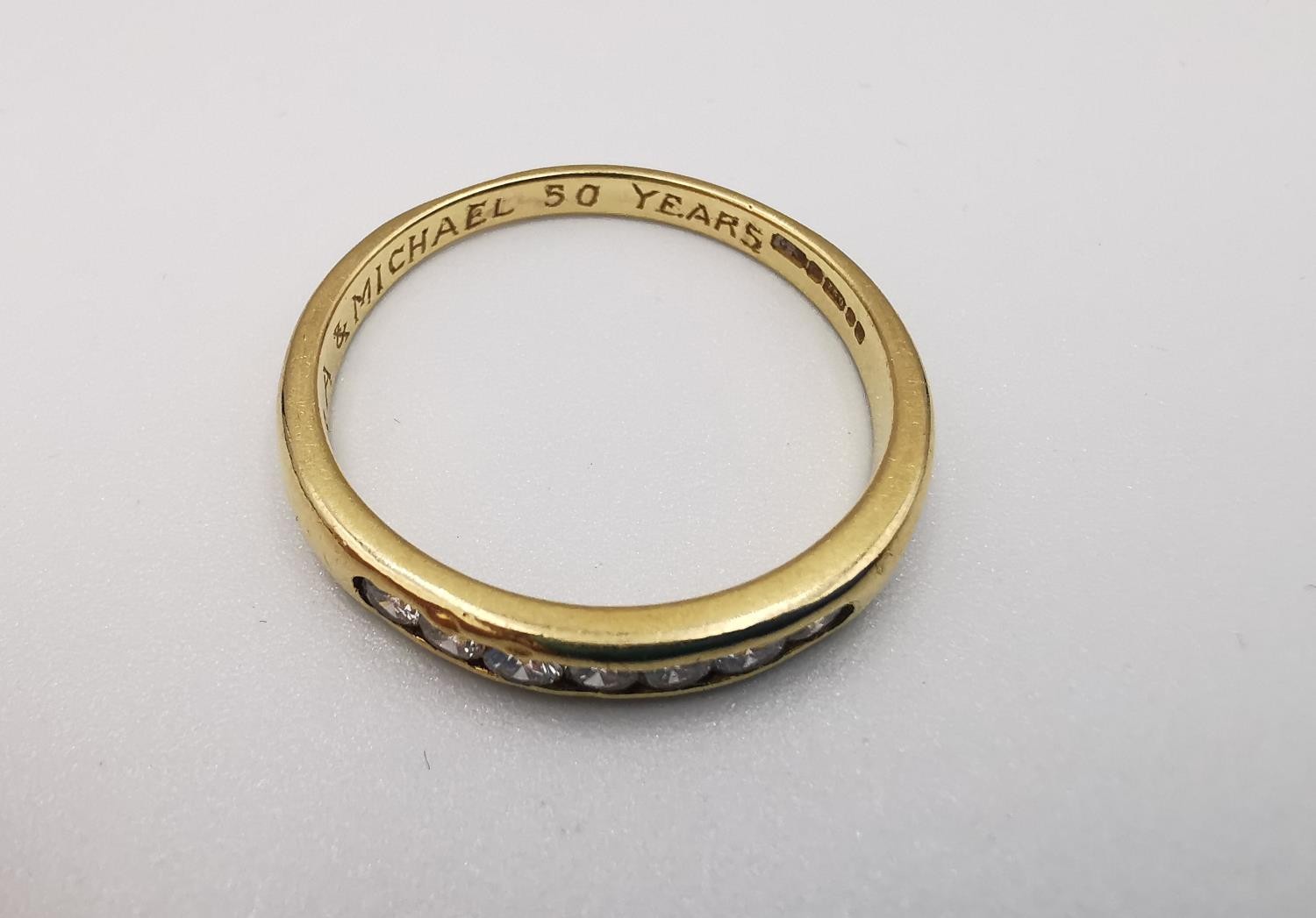 An 18ct yellow gold diamond seven stone half eternity style ring. Set with seven round brilliant cut - Image 2 of 5