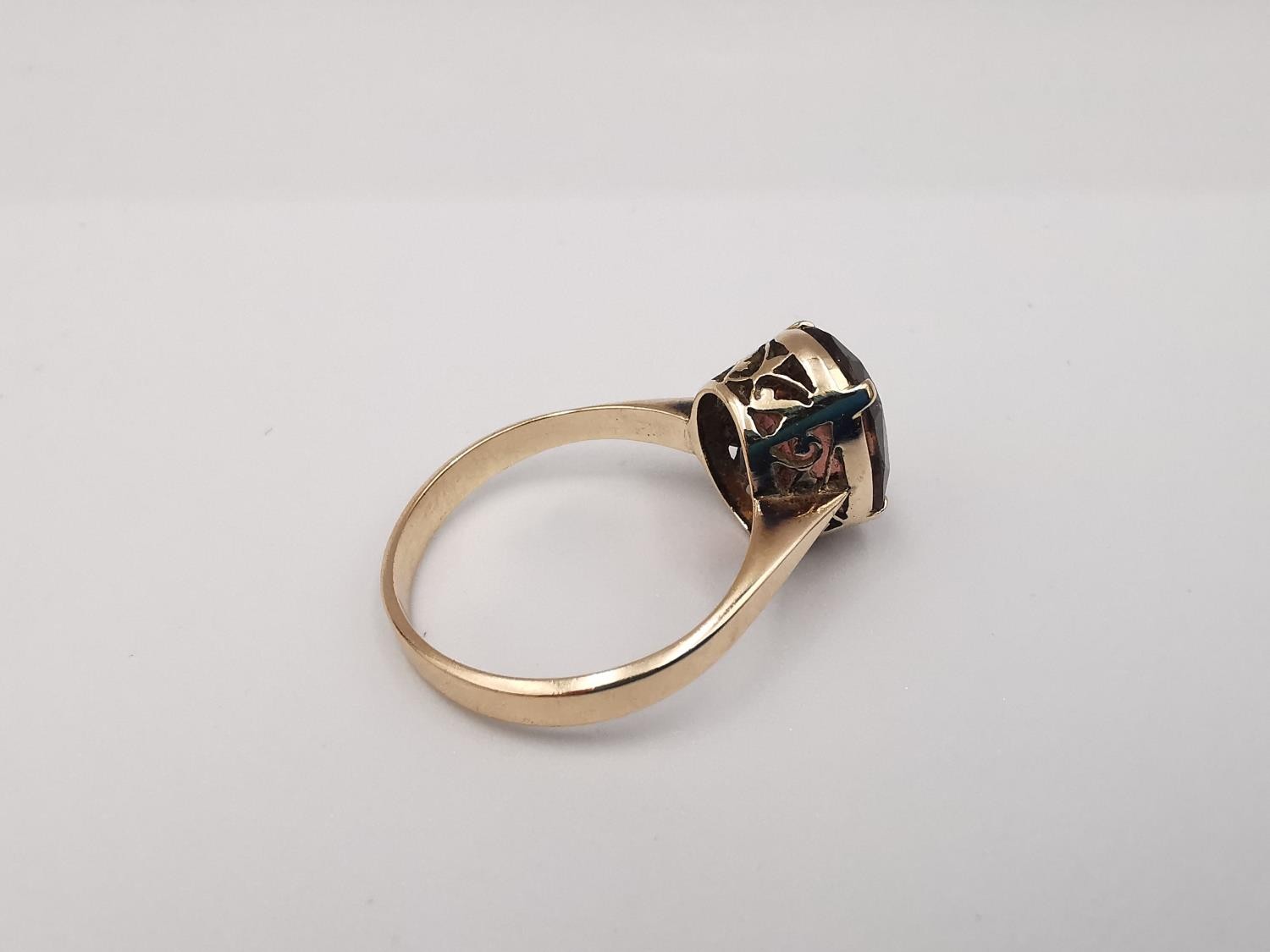 A yellow metal (tests as 9ct or higher) tourmaline dress ring. Set with an oval mixed cut pink - Image 3 of 5