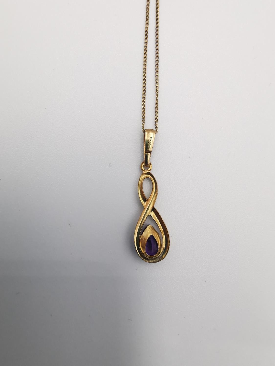 A 9ct rose gold and amethyst pendant with chain and earrings set. The infinity design pendant set - Image 4 of 8