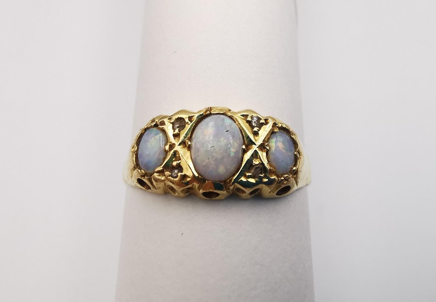 A Victorian 18ct yellow gold three stone opal and diamond ring. Set with three oval opal cabochons - Image 2 of 5
