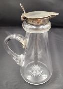 An Edwardian silver topped whiskey noggin by Hukin & Heath. Star cut base and hinged lid.