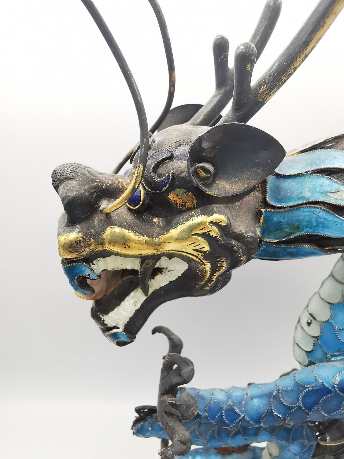 An early 20th century Chinese white metal and cloisonne enamel wirework dragon on a carved cloud - Image 6 of 9