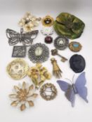 A collection of eighteen costume and antique brooches, including a pewter brooch by Felix Muller,