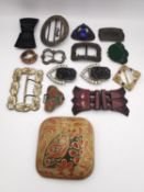 A collection of vintage and antique buckles, including an square enamel buckle with owl motif, a