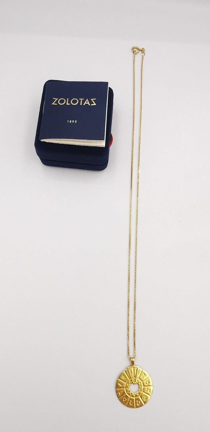 A boxed 18 carat yellow gold pendant by Zolotas and 14ct chain. The pendant in the form of a - Image 2 of 5