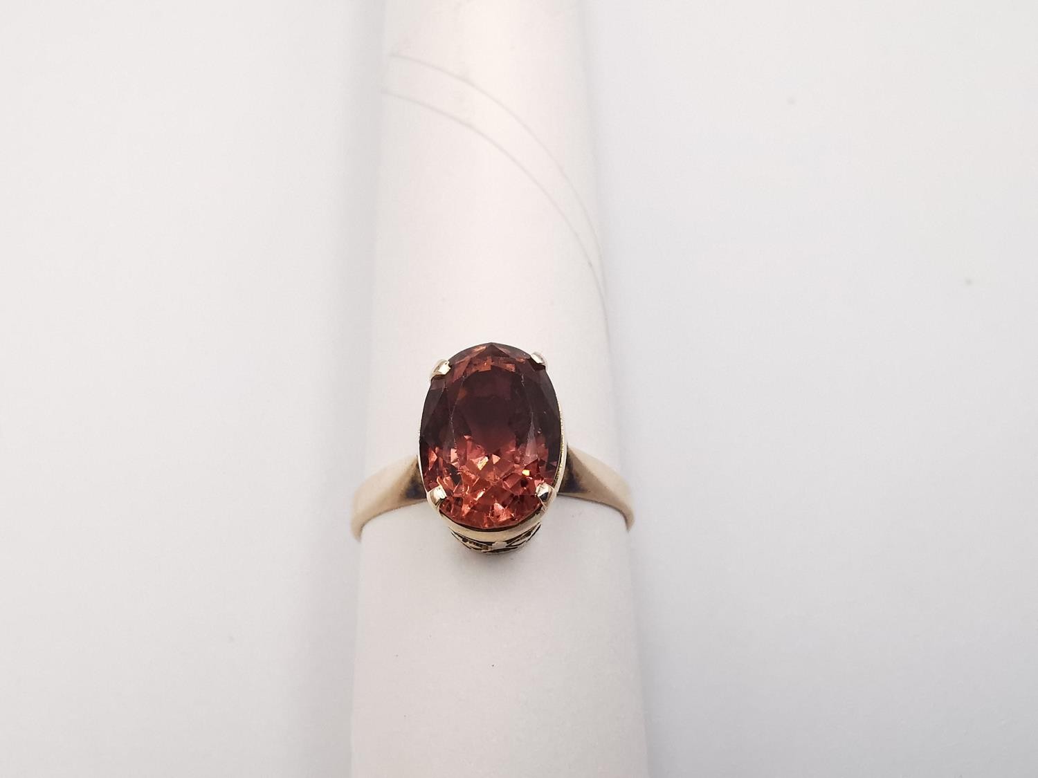 A yellow metal (tests as 9ct or higher) tourmaline dress ring. Set with an oval mixed cut pink - Image 5 of 5