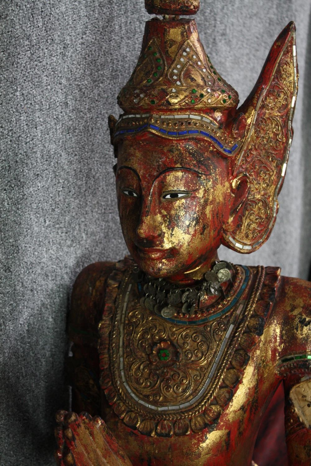 A large carved Buddha in a boat or canoe. Gilded and decorated with small mirror tiles. H.125 W. - Image 4 of 8