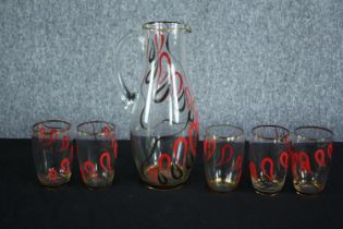 A vintage hand painted and gilded glass water jug and five matching glasses. H.29 cm. (largest)